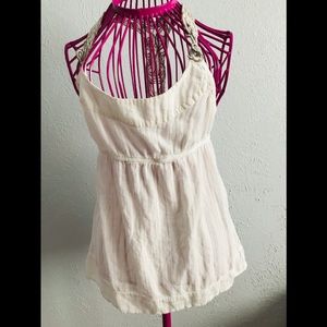 White blouse with brown and white straps